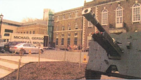 An Old Military Gun In Front Of The Gerson Offices