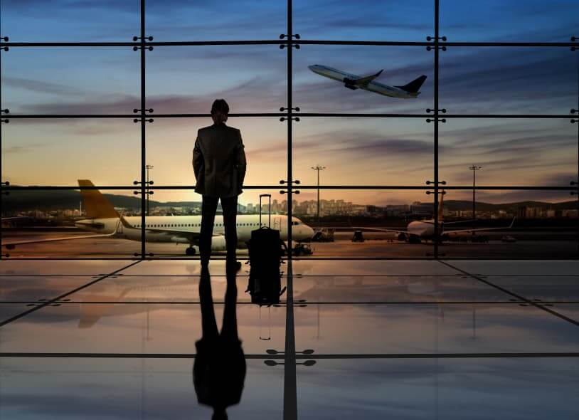 Man In Suit At An Airport