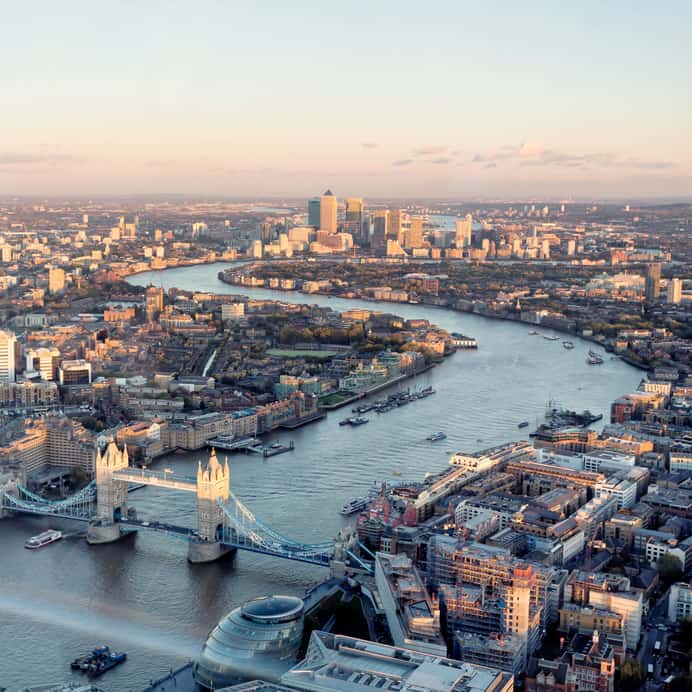 London Aerial Cityscape With Landmarks Including The Thames, Canary Wharf, Tower Bridge And City Hall.