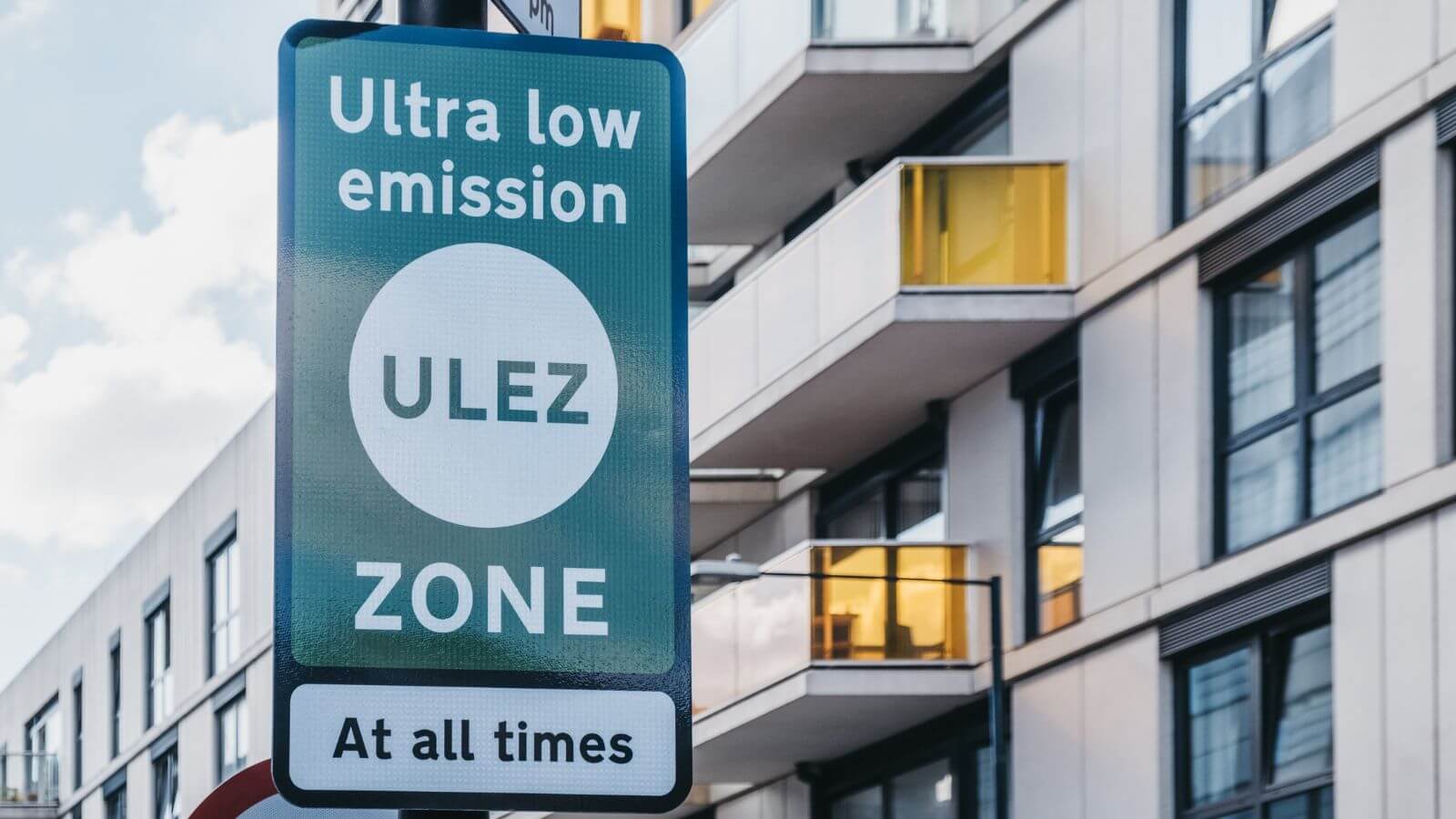 An Ultra Low Emission Zone (ULEZ) Sign On A Street In London