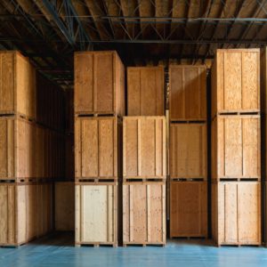 Lined up wooden crates in storage warehouse