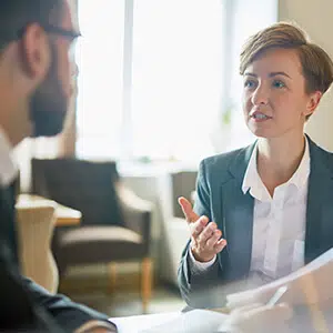 Two people talking about a document