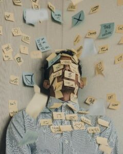 Man covered in post-it notes
