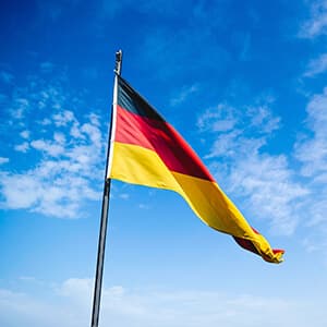 German flag against a blue sky