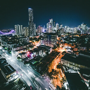 Night-time lights of Brisbane city centre with skyscrapers in the distance