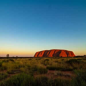 Panoramic view of the sun setting over Uluru & Kata Tjuta National Park, Australia