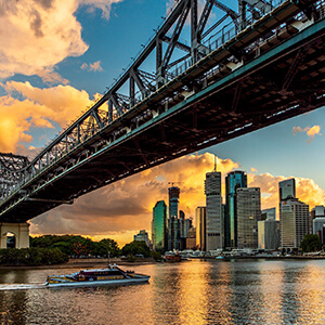 View of The Story Bridge and Brisbane City skyline from Brisbane River Walk at sunset