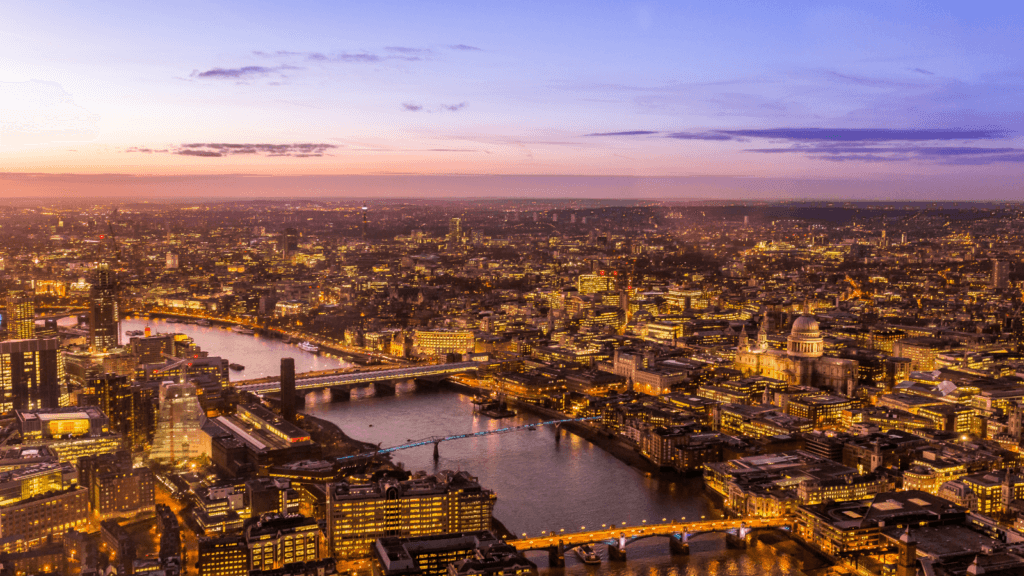 View over central London at dusk with the buildings all lit up