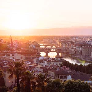 A summer evening view over the top of Florence, with a view of the chain of bridges