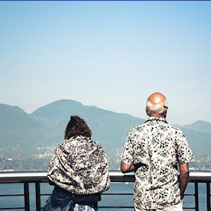 Couple looking over the water in Vancouver, Canada