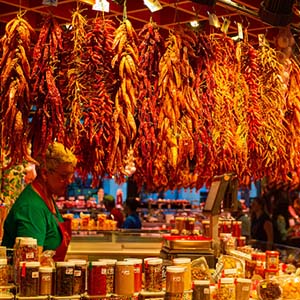 Woman standing in a spice and chilli market in Barcelona