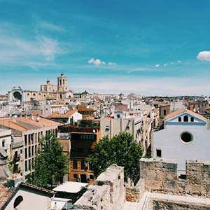 a view of Tarragona, Spain town with old architecture and blue skies