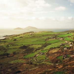 View across farmers’ fields in West Ireland with houses dotted over the countryside