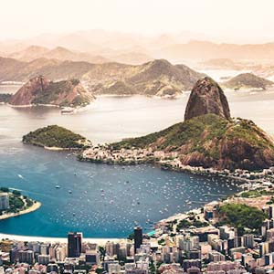 Aerial view of the city and coastline of Rio de Janeiro, Brazil, looking out onto the sea and islands