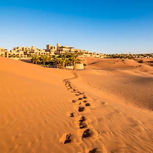 Human footprints in a sandy desert in Abu Dhabi, United Arab Emirates.