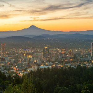 Portland city in Oregon with high-rise buildings at sunset