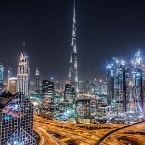 Central Business District of Dubai lit up at night time
