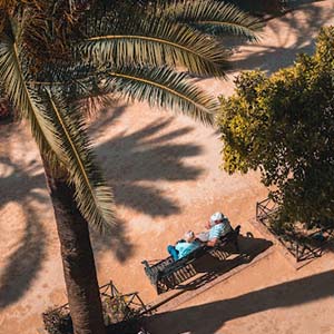 Aerial view of an older couple on a bench in Spain