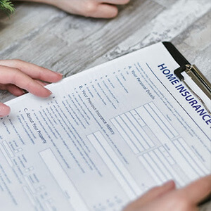 Clipboard holding a home insurance questionnaire