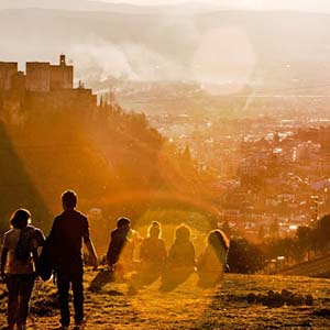 Friends gathered on a hill in Granada, Spain