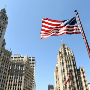 American flag waving from a flagpole in downtown Chicago, Illinois