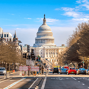 A wide road leading to the United States Capitol building in Washington