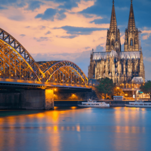 The Cologne Cathedral and Hohenzollern bridge across the Rhine river in Germany