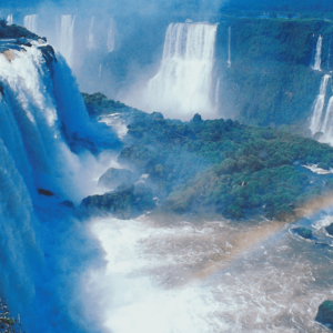 aerial view of the Iguacu Falls in Brazil with a rainbow in the foreground