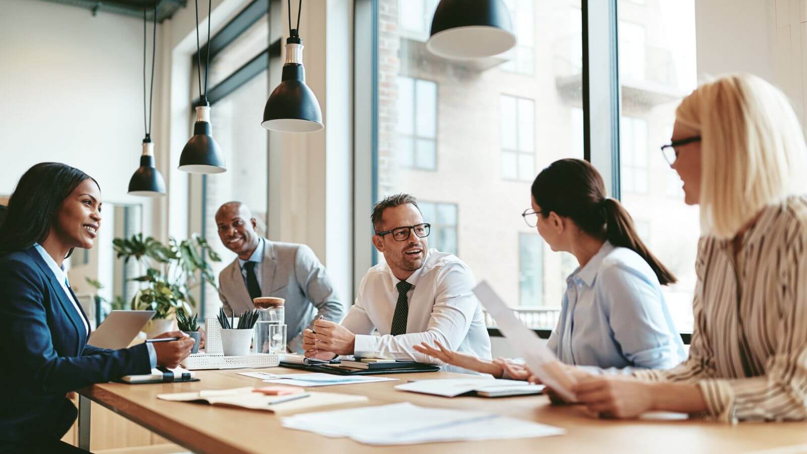 A Business Meeting With People In Discussion